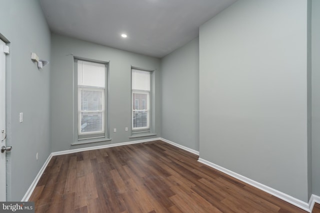 spare room featuring dark hardwood / wood-style floors