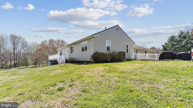 view of side of home featuring a lawn