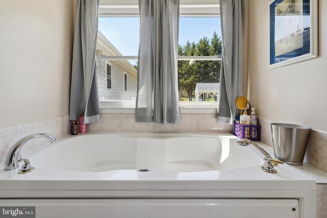 bathroom with a washtub