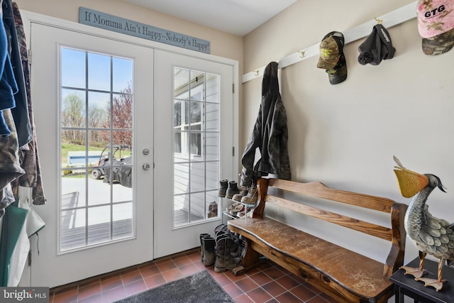 entryway with french doors and dark tile floors