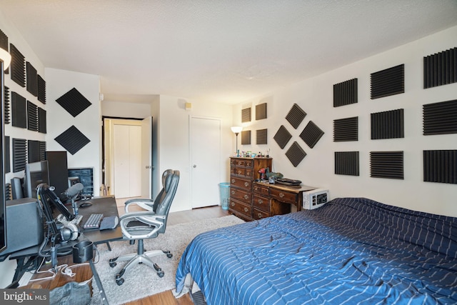 bedroom with dark hardwood / wood-style floors