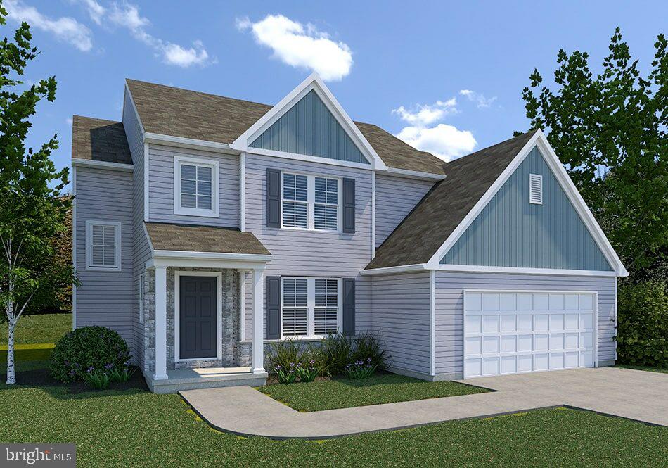 view of front of home with a front lawn and a garage