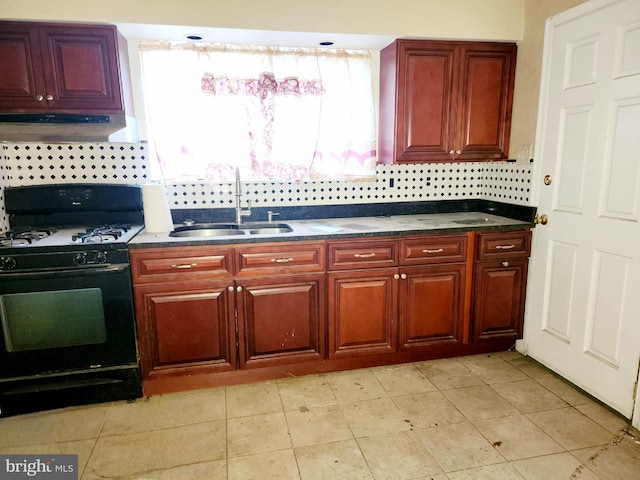 kitchen with tasteful backsplash, exhaust hood, white gas range, sink, and light tile flooring