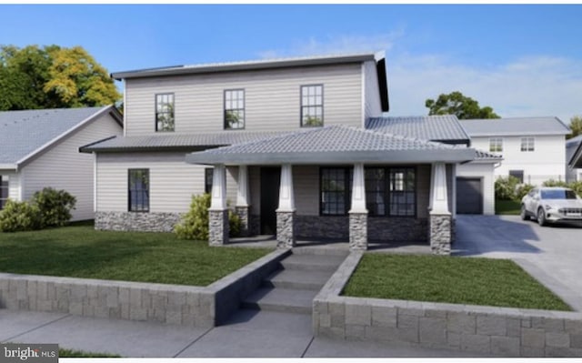 view of front facade featuring a front yard and a garage