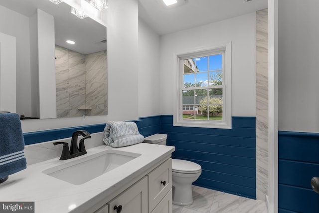 2764 Bellview Dr, Bensalem, PA 19020 - full bath featuring marble look tile flooring, wainscoting, toilet, vanity, and tiled shower