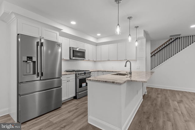 2764 Bellview Dr, Bensalem, PA 19020 - kitchen featuring stainless steel appliances, light wood-type flooring, a sink, white cabinetry, and recessed lighting