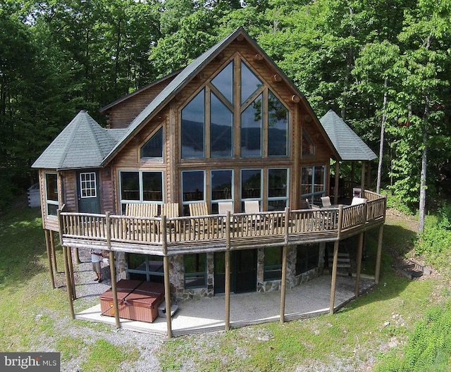 back of house with a patio and a wooden deck