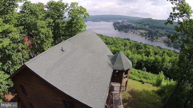 birds eye view of property with a water view