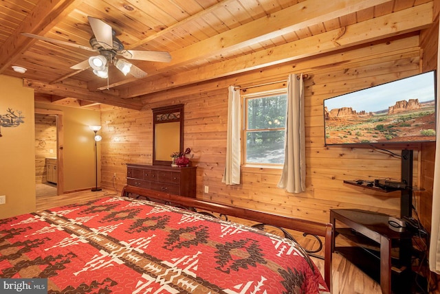 bedroom featuring beamed ceiling, hardwood / wood-style flooring, and wood ceiling