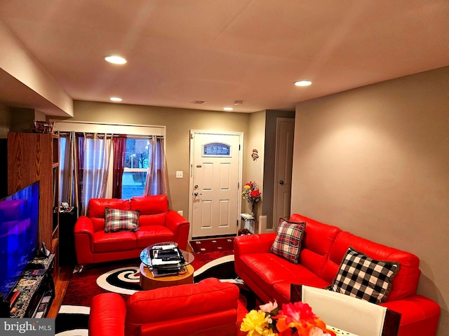 living room featuring dark hardwood / wood-style flooring