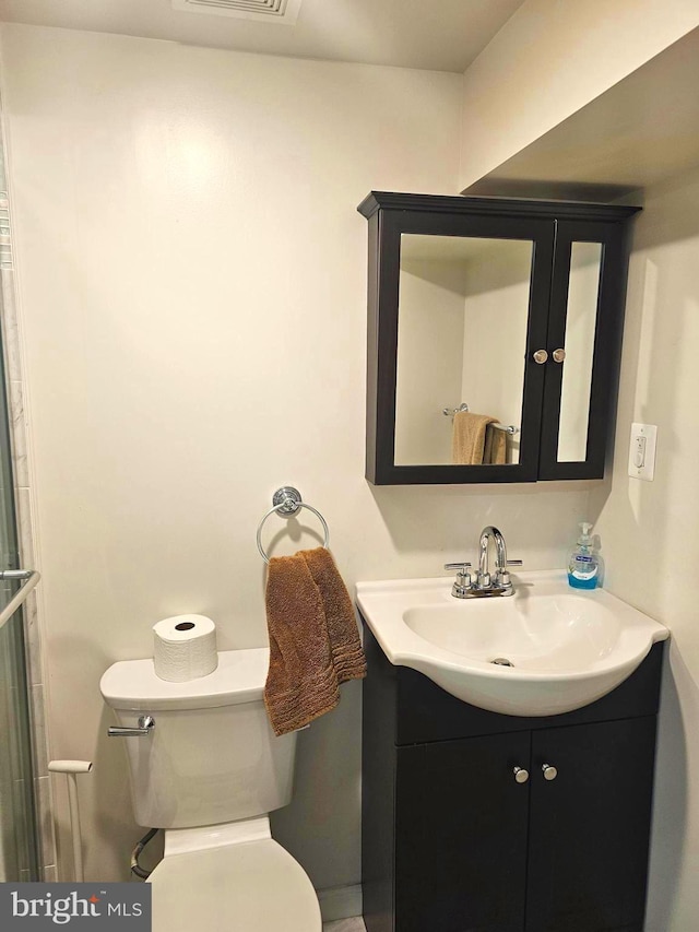 bathroom with toilet and vanity