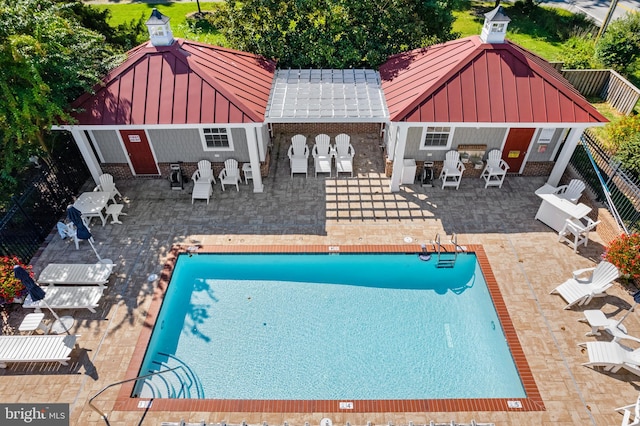 view of swimming pool featuring a patio