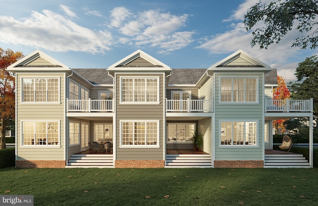 back of property featuring a lawn and a balcony