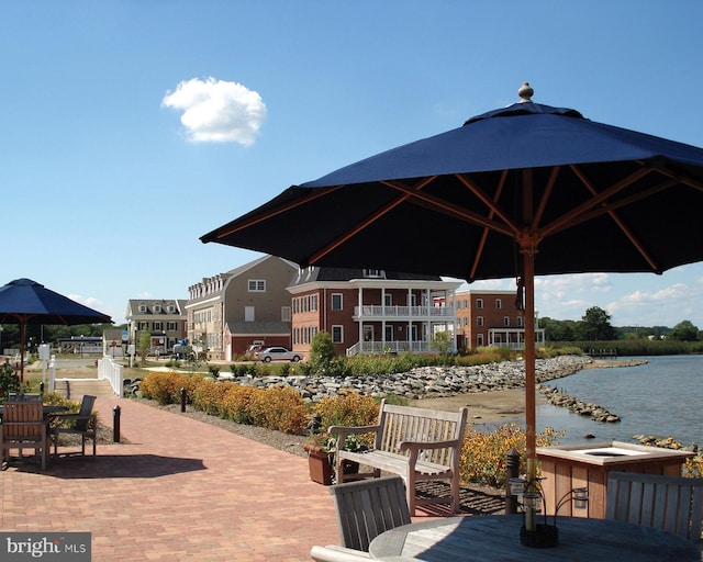 view of community with a water view