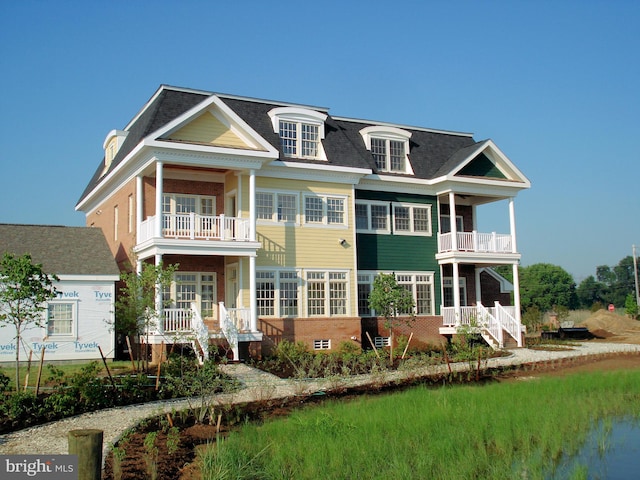 view of front of home with a balcony