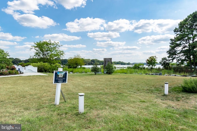 surrounding community featuring a water view