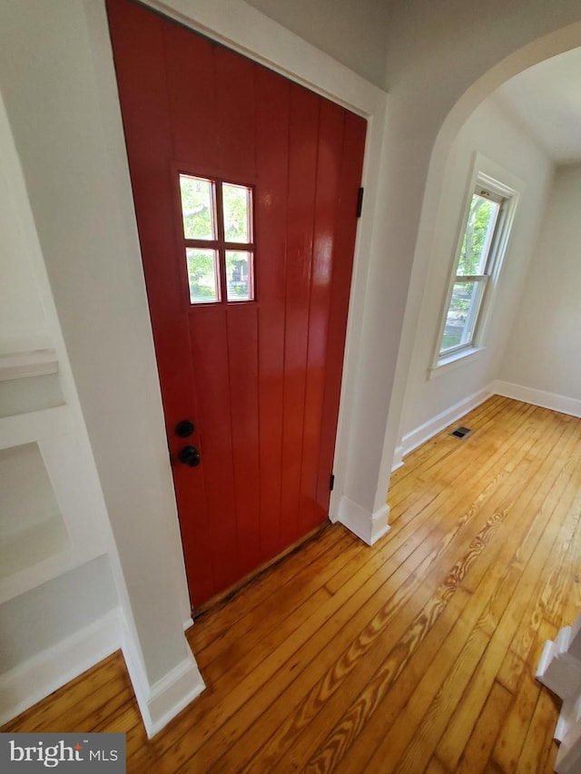 entryway with light hardwood / wood-style flooring