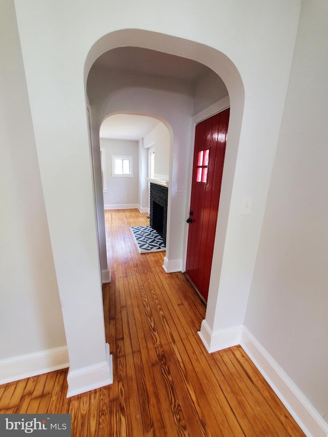 hall with light hardwood / wood-style flooring