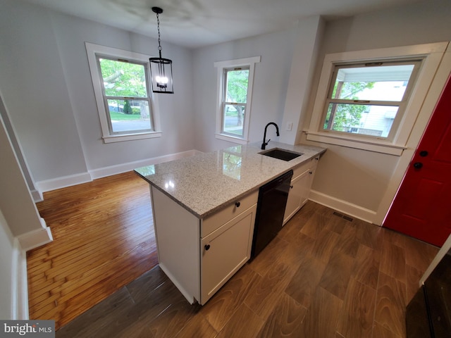 kitchen featuring sink, dark wood-type flooring, white cabinetry, and light stone counters