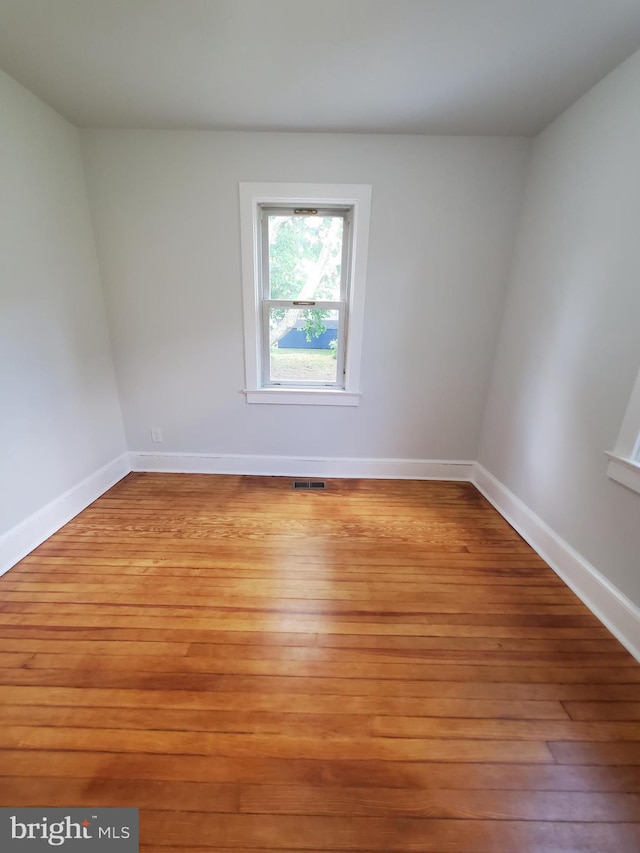 unfurnished room featuring light hardwood / wood-style flooring