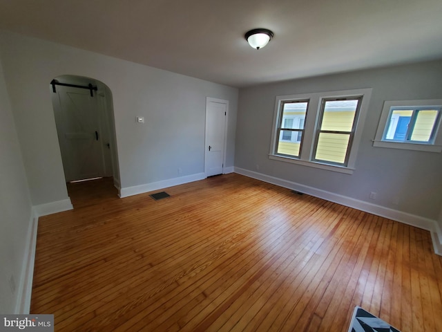 spare room with dark hardwood / wood-style flooring