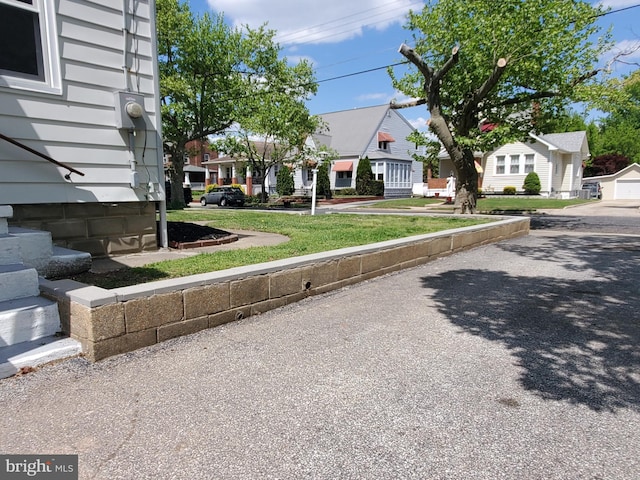 exterior space featuring a front lawn