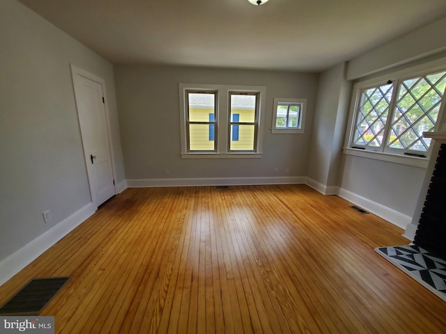 unfurnished room with light hardwood / wood-style flooring