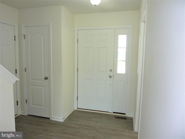 foyer entrance with dark wood-type flooring