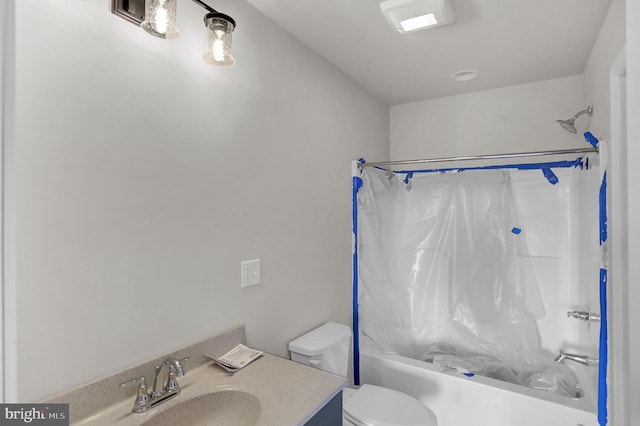 full bathroom featuring shower / bathtub combination with curtain, toilet, and vanity