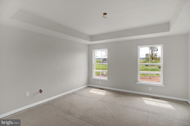 empty room with a tray ceiling