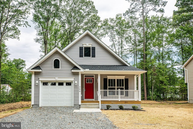 view of front of house with a garage and a porch