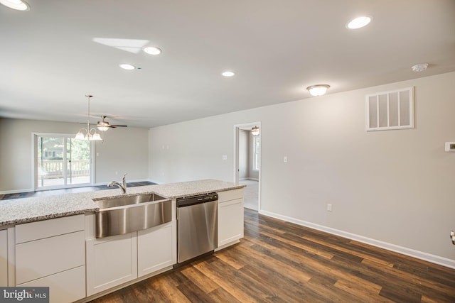 kitchen with dark hardwood / wood-style flooring, light stone counters, white cabinets, a notable chandelier, and stainless steel dishwasher