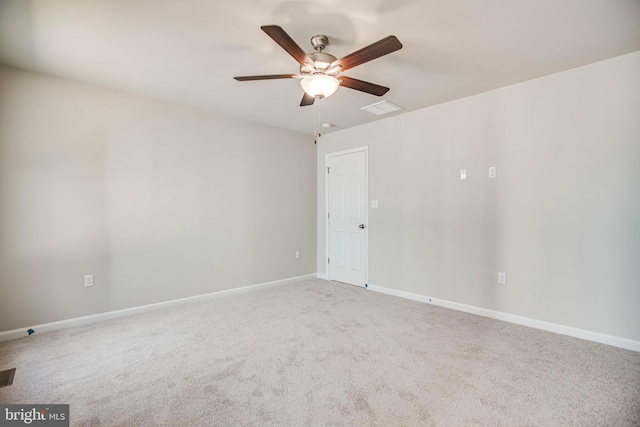 unfurnished room featuring light colored carpet and ceiling fan