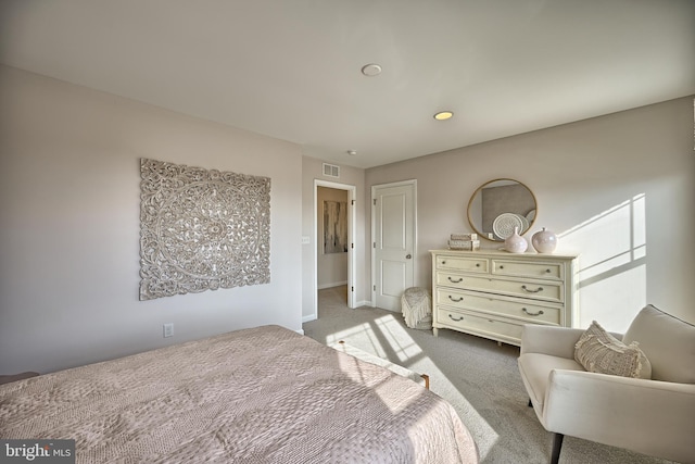 bedroom featuring light carpet