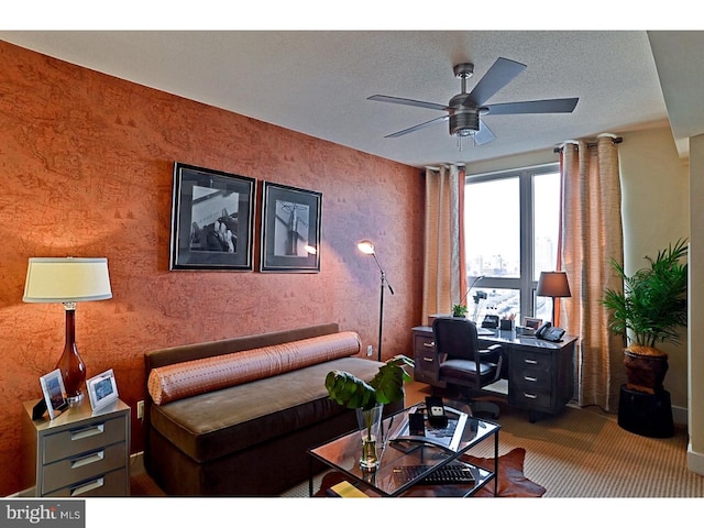 living room with ceiling fan, a textured ceiling, and carpet floors