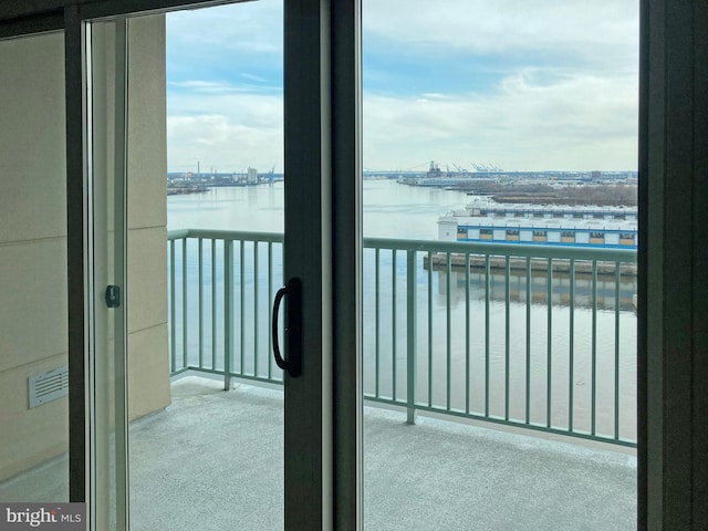 balcony featuring a water view