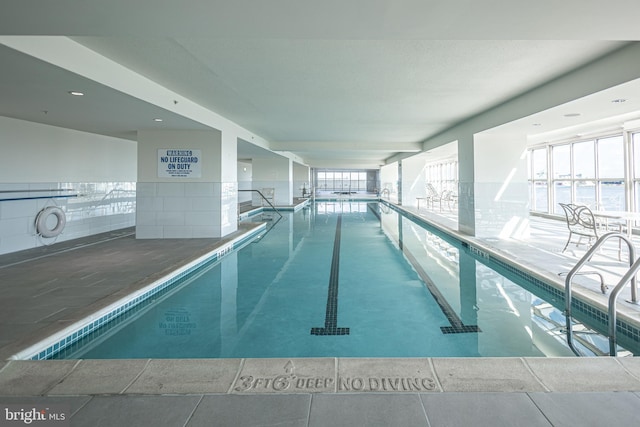 view of pool featuring a water view