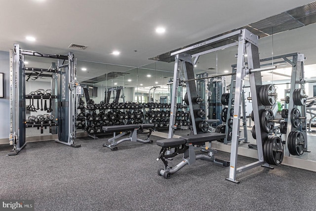 exercise room featuring recessed lighting and visible vents