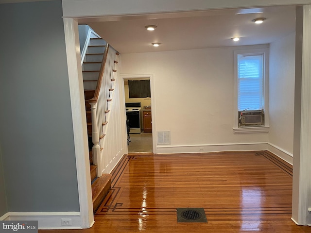 corridor with dark hardwood / wood-style floors