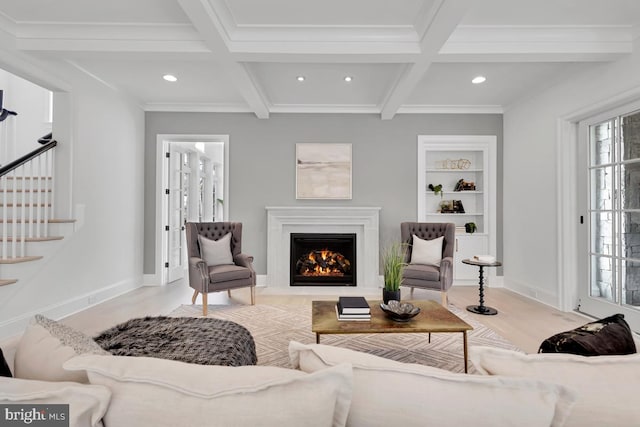 living room with coffered ceiling, beam ceiling, and light wood-type flooring