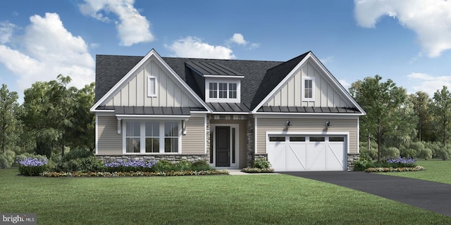 view of front of house featuring a front lawn and a garage