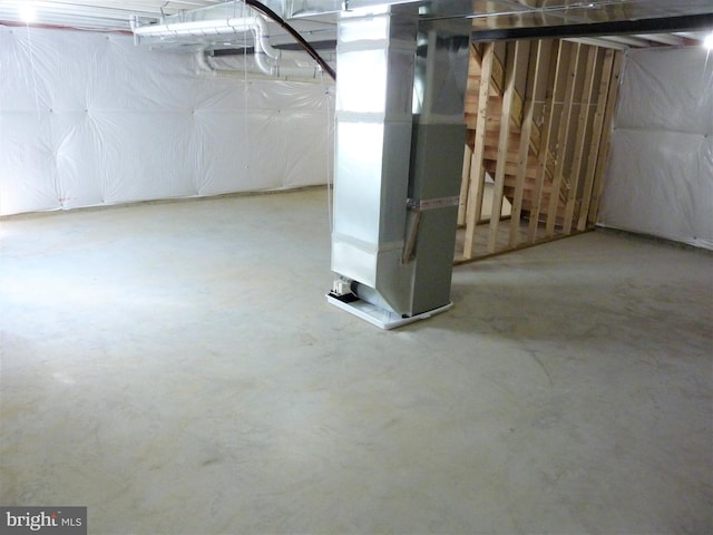 basement featuring heating utilities