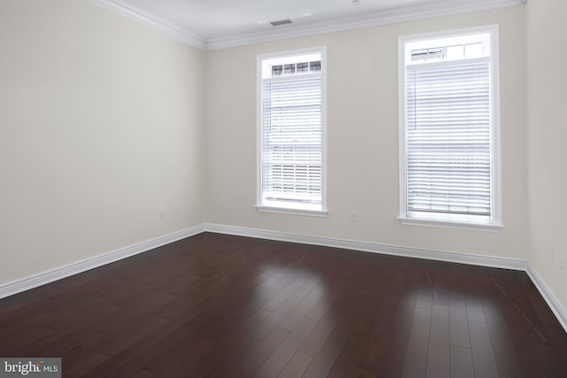 unfurnished room with crown molding and dark wood-type flooring