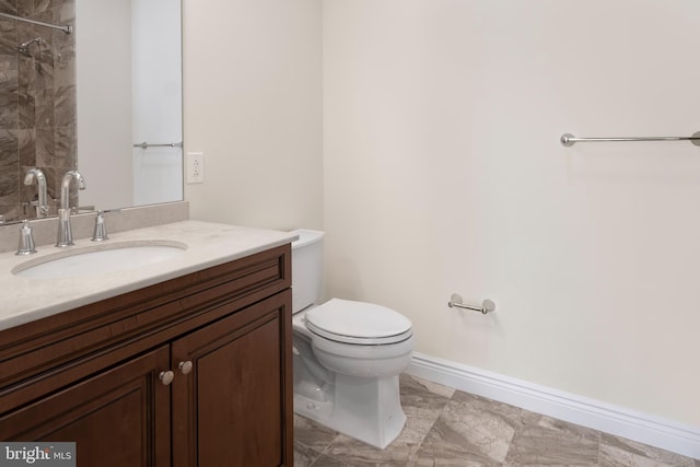 bathroom with toilet, tile floors, and oversized vanity