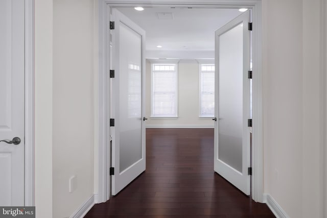 hall with dark hardwood / wood-style floors