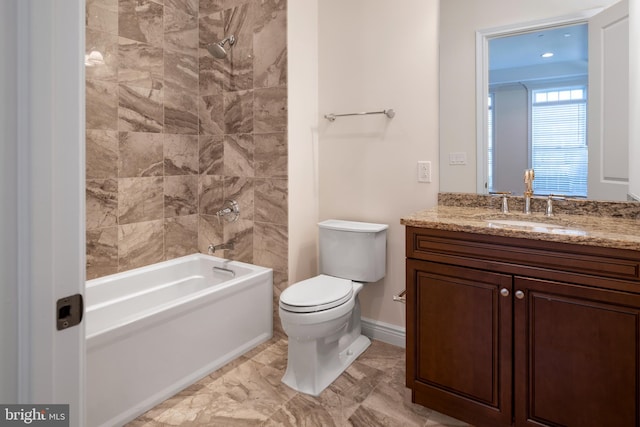 full bathroom featuring tile floors, toilet, vanity, and tiled shower / bath