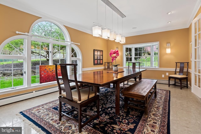 dining room with crown molding, a healthy amount of sunlight, and light tile floors