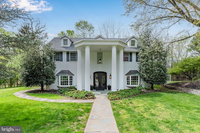 neoclassical / greek revival house with a front yard