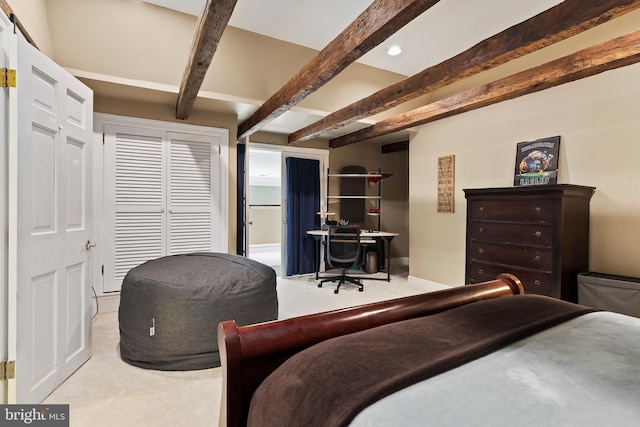 bedroom featuring light carpet and beamed ceiling