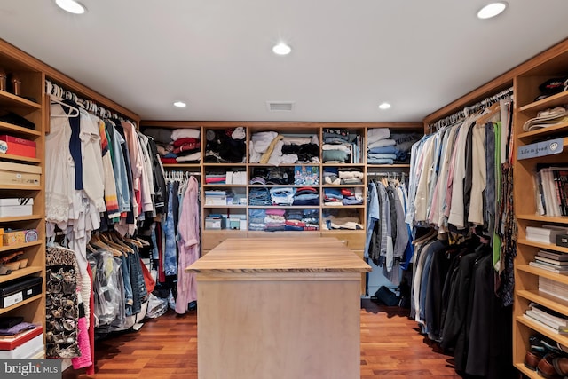 walk in closet featuring light hardwood / wood-style flooring